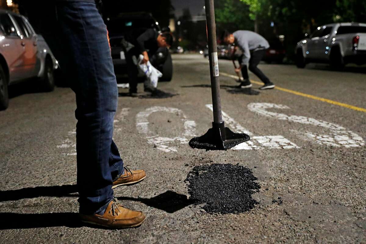 Oakland's Pothole Vigilantes address gaping problem, one road crater at a  time