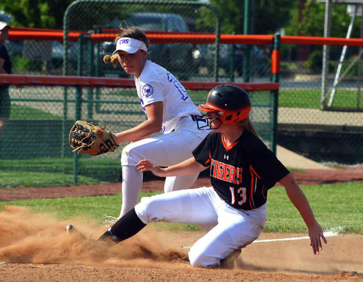 Edwardsville’s Katherine Bobinski-Boyd, right, slides safely into third base with a triple on Friday during the championship game of the Edwardsville Class 4A Regional.