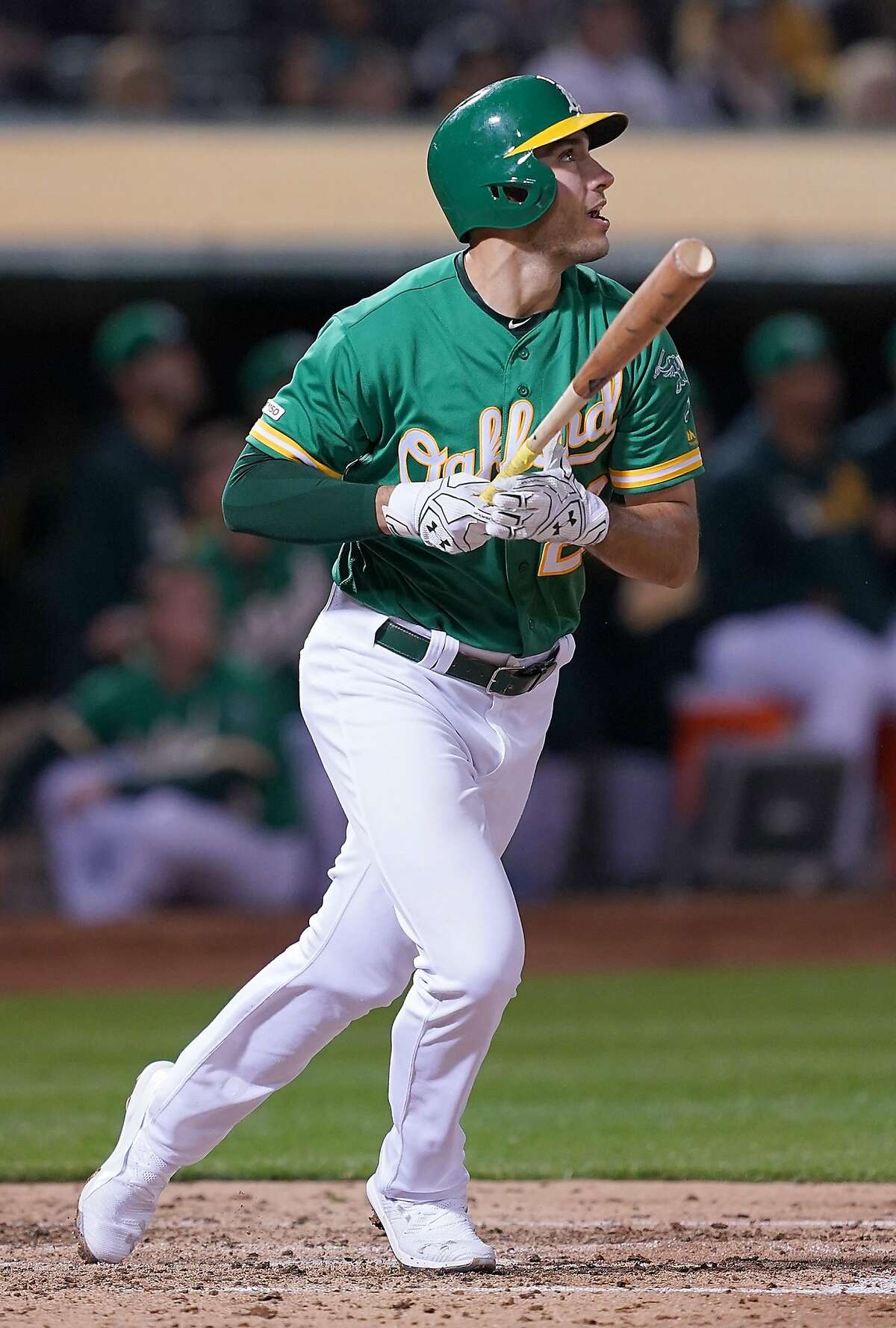 Matt Olson of the Oakland Athletics swings and watches the flight of