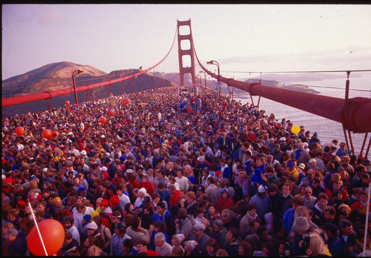 Hundreds of thousands of people crowded onto the Golden Gate Bridge to celebrate its 50th anniversary. San Francisco, California, May 24, 1987.