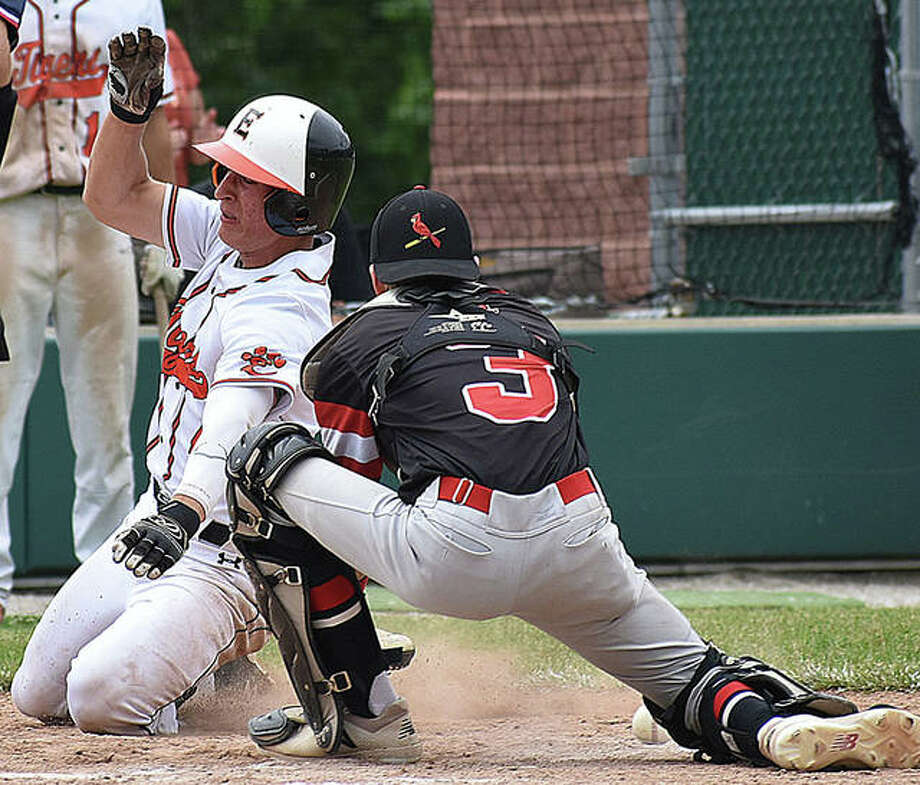 Edwardsville’s Joe Copeland, left, slides safely into home ahead of the tag by Alton catcher Owen Stendeback in the Class 4A Alton Regional championship game on Saturday at AHS. Photo: Matt Kamp, Intelligencer | For The Telegraph