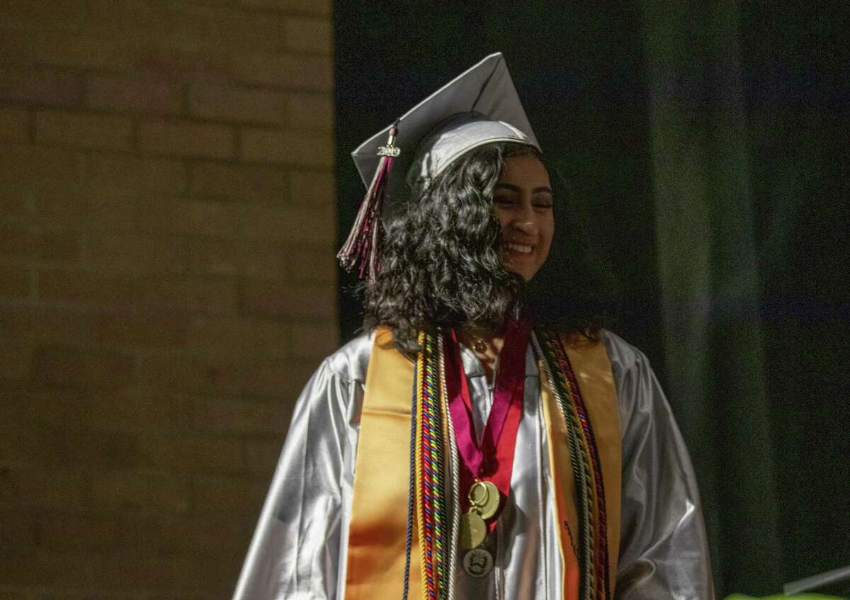 Hauke salutatorian Denise Umana walks the stage during a graduation ceremony Saturday, May 25, 2019 at Conroe High School in Conroe.