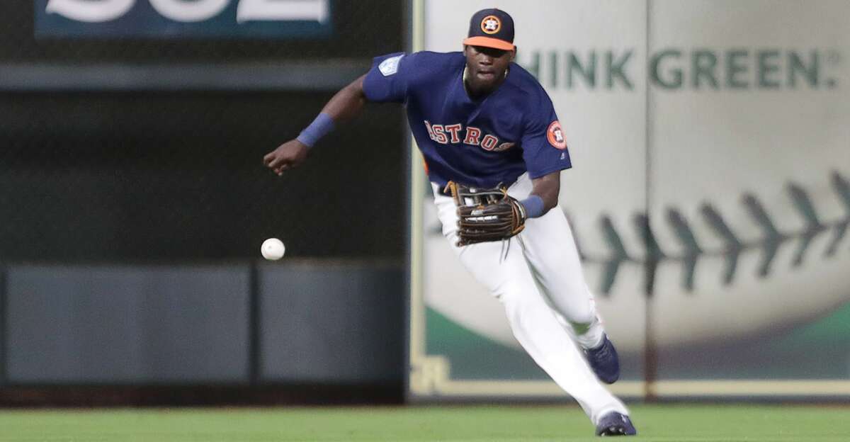 Houston Astros outfielder Yordan Alvarez (72) fields a ball during the eighth inning of a spring training game at Minute Maid Park on Monday, March 25, 2019, in Houston.