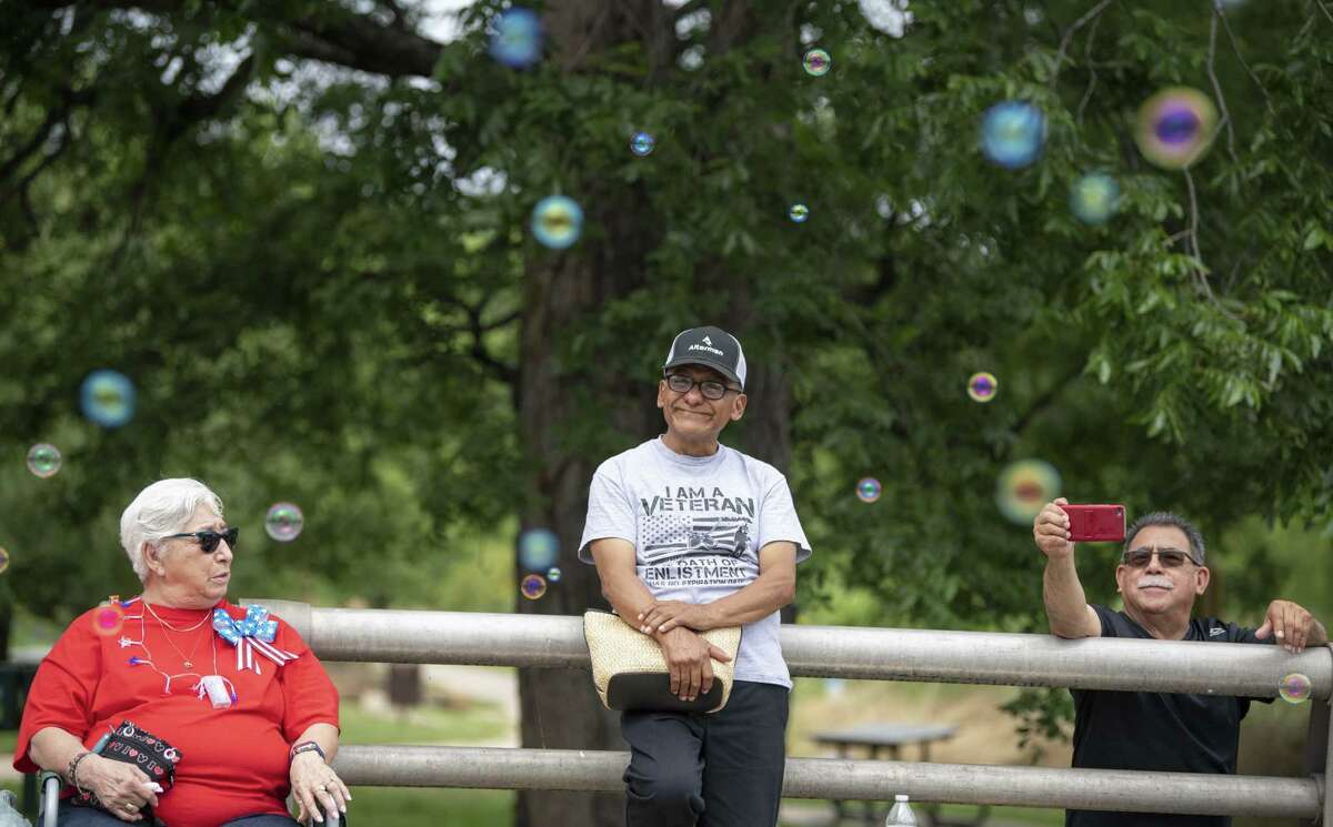 A veteran looks at bubbles along the The Lone Star Neighborhood Association?•s Memorial Day weekend parade on Saturday, May 25, 2019.