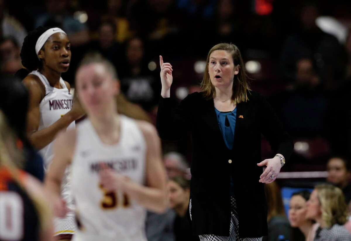 FILE - In this Jan. 6, 2019, file photo, Minnesota coach Lindsay Whalen gestures during the team's NCAA college basketball game against Illinois in Minneapolis. Whalen's team got off to a perfect start, winning all 11 non-conference games and earning a Top 25 ranking. Then Big Ten play set in and the Golden Gophers struggled, losing seven of their first nine games in the conference. Losing games helped give Whalen a better perspective of what it took to be a good coach. (AP Photo/Andy Clayton-King, File)