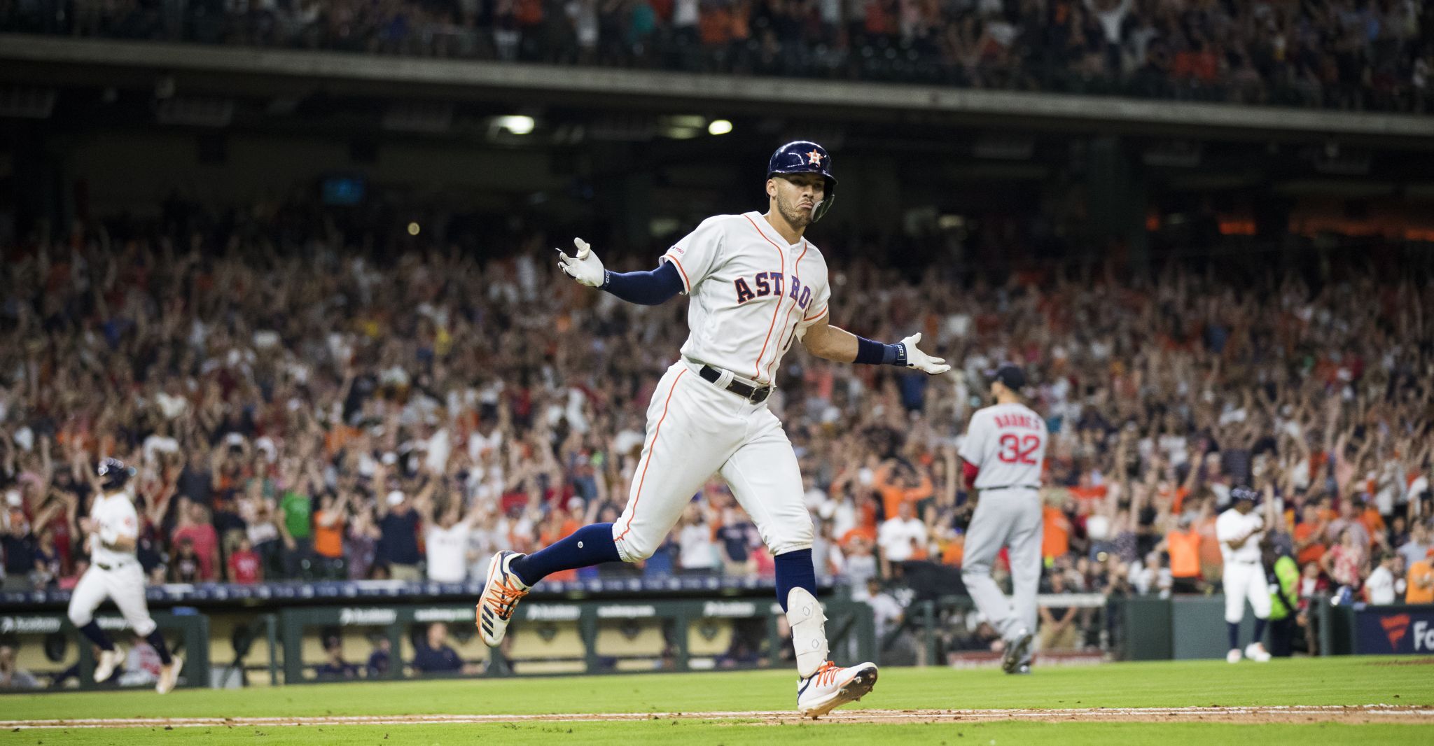 Houston Astros center fielder Jake Marisnick, left, fields a doubly by  Boston Red Sox's Mookie Betts as right fielder Josh Reddick (22) watches  during the fourth inning of a baseball game Friday