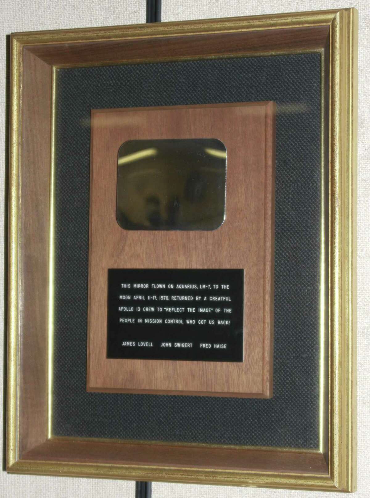 The mirror the Apollo 13 crew presented presented to mission control for helping them survive. The plaque reads “This mirror flown on Aquarius, LM-7, to the moon April 11-17, 1970. Returned by a greatful Apollo 13 crew to ‘reflect the image’ of the people in Mission Control who got us back! James Lovell John Swigert Fred Haise.”
