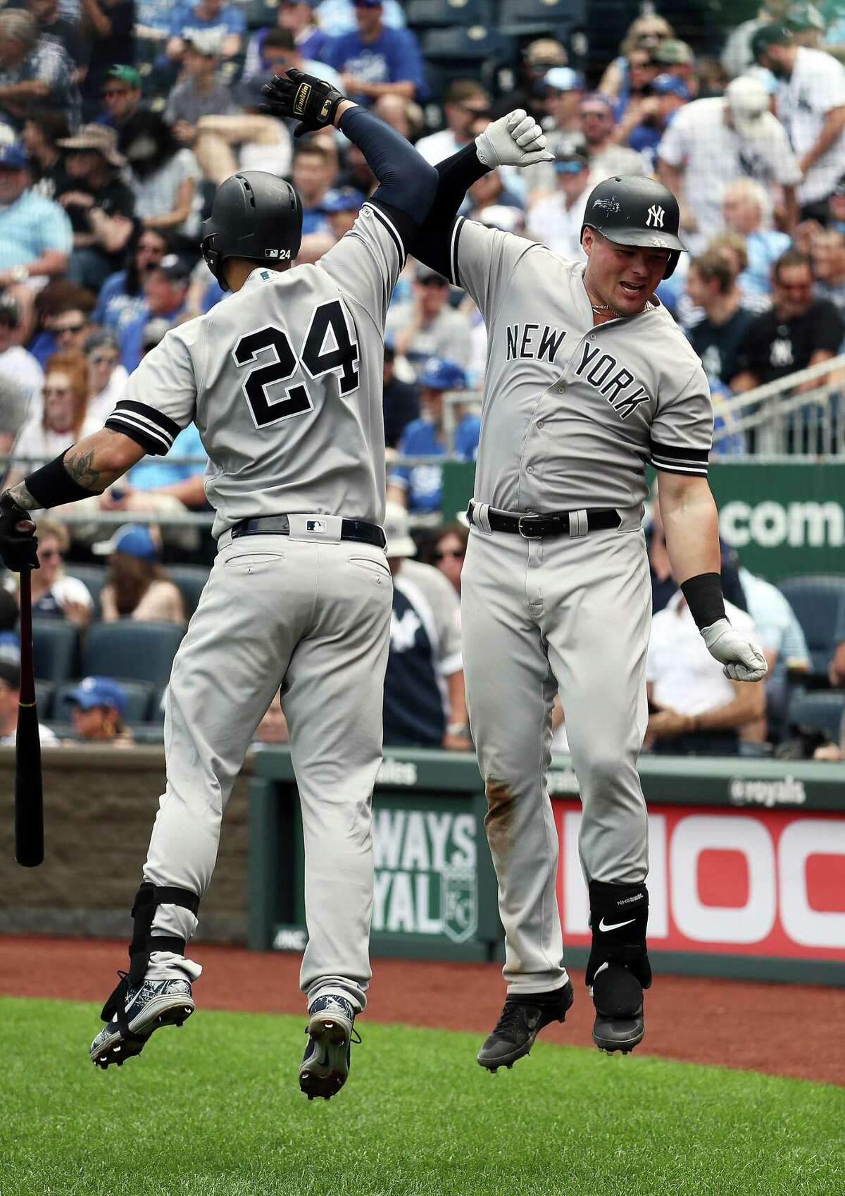 KANSAS CITY, MISSOURI - MAY 25: Luke Voit #45 of the New York Yankees is congratulated by Gary Sanchez #24 after hitting a two-run home run during the 7th inning of the game against the Kansas City Royals at Kauffman Stadium on May 25, 2019 in Kansas City, Missouri. (Photo by Jamie Squire/Getty Images)