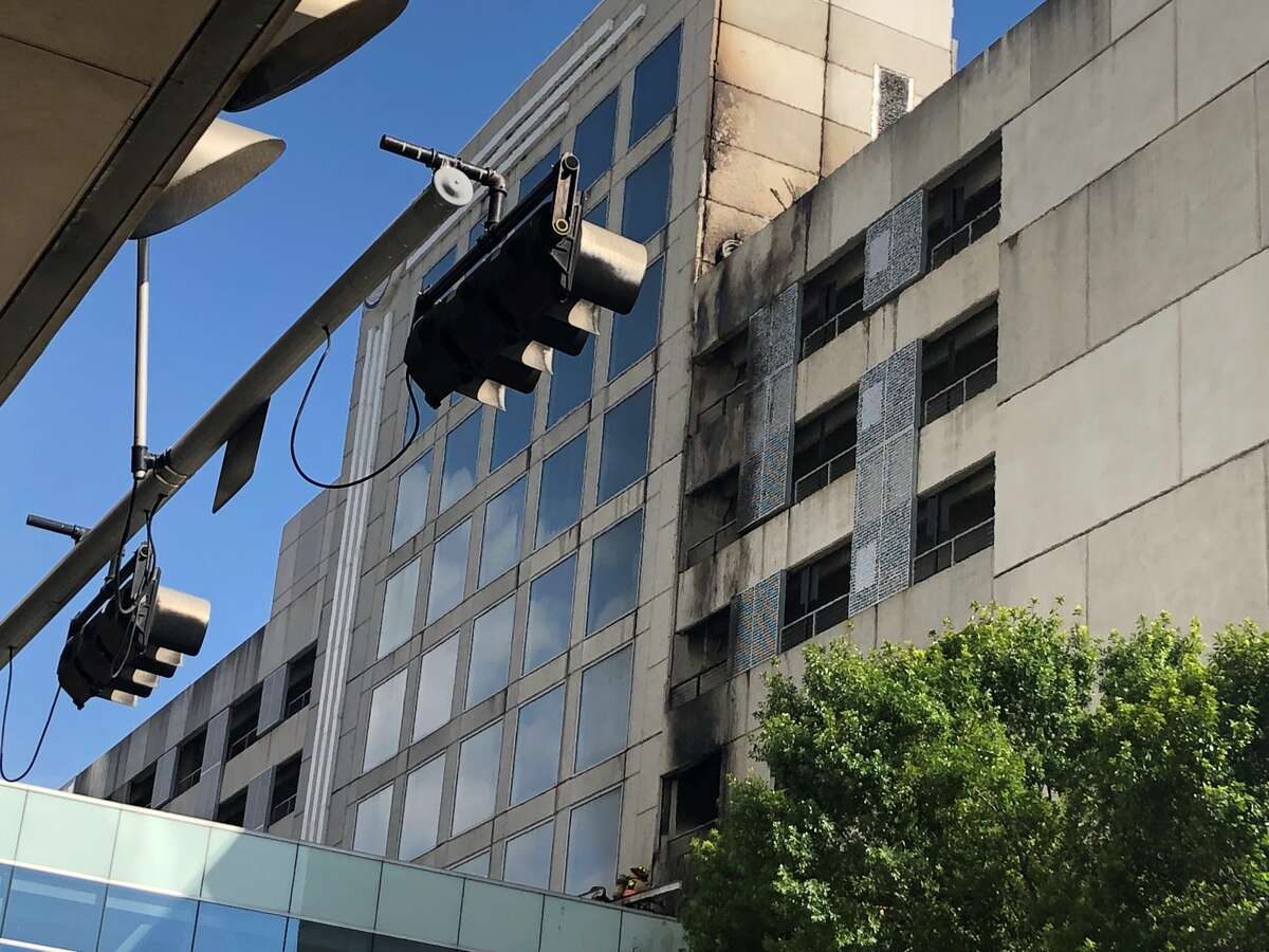 Car fire erupts in Hilton parking garage in downtown Houston