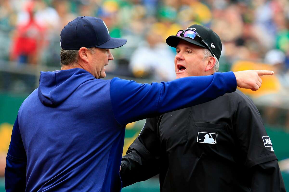 OAKLAND, CALIFORNIA - MAY 26: Manager Scott Servais #29 of the Seattle Mariners argues a call after being ejected by Umpire Mike Everitt #57 during the seventh inning against the Oakland Athletics at Oakland-Alameda County Coliseum on May 26, 2019 in Oakland, California. (Photo by Daniel Shirey/Getty Images)
