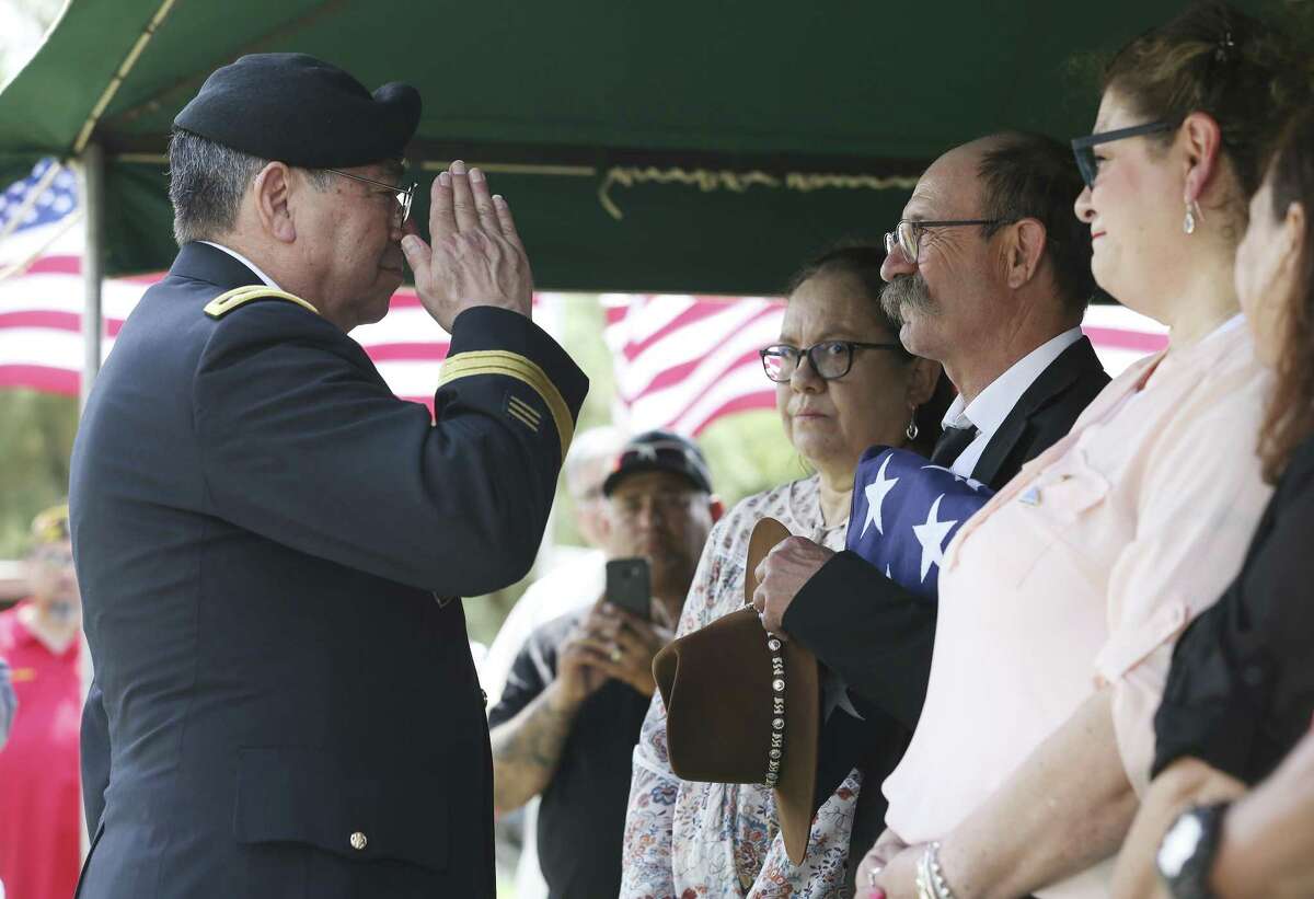 Retire Lt. Gen. Ricard Sanchez (left) salutes after giving the memorial flag to Herschel Marvin Saenz during the funeral service and memorial for Saenz's uncle, Herschel Marvin Riggs, who was considered missing in action from the Korean War on Saturday, May 25, 2019 in Pearsall, Texas. Services for Army Private First Class Herschel Marvin Riggs were held at Immaculate Heart of Mary Catholic Church in Pearsall. Riggs was considered missing in action for 69 years with his remains kept at the national cemetery in Honolulu. Through DNA tests, Riggs was identified and his cremated remains were brought back to Texas for his family to finally honor him and his service. His oldest surviving nephew, Herschel Marvin Saenz, was the recipient of the U.S. flag presented to him by retired Lt. Gen. Ricardo Sanchez, who served in the 24th Infantry - the same division as Riggs but several decades later. Taps played at the Pearsall Catholic cemetery and a 21-gun salute by the Honor Guard of Fort Sam Houston memorialized Riggs' service to the country in front an extended family and friends. Riggs was posthumously awarded a Purple Heart, the Combat Infantryman's Badge, the Korean Service Medal, the United Nations Service Medal, the National Defense Service Medal and the Korean War Service Medal. Riggs was 18 years old at the time of his death. (Kin Man Hui/San Antonio Express-News)
