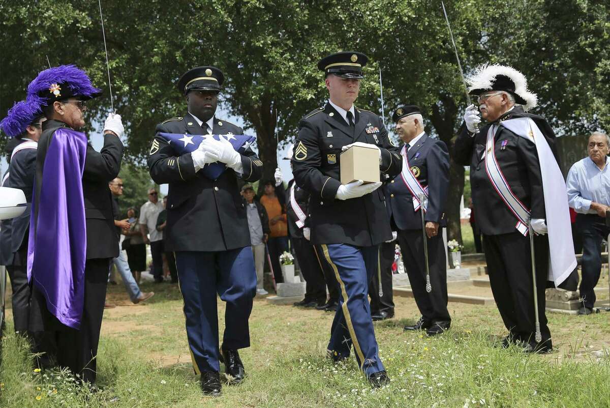 Army Staff Sgts. Tyler Hayes (right) and Lindbergh Perryman escort the remains of Pfc. Herschel Riggs in a service in Pearsall for the once-missing soldier who died in Korea. His ashes were interred at the foot of his sister’s grave.