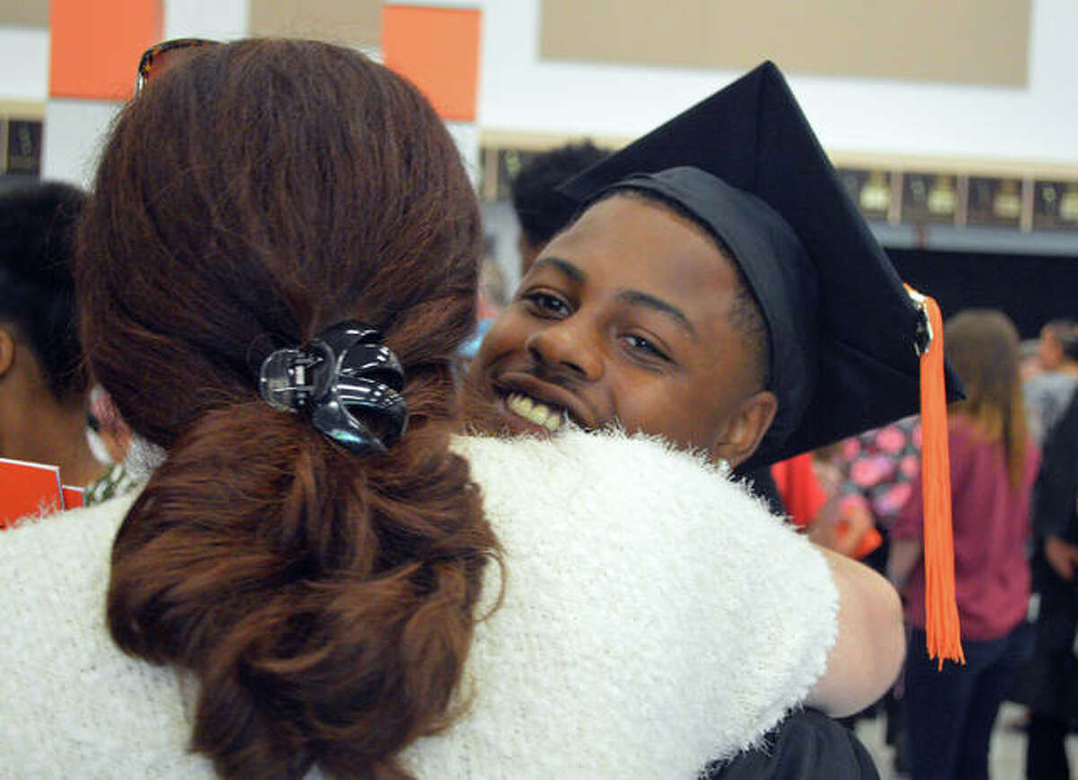 Hugs were the order of the day during Saturday’s Edwardsville High School graduation ceremony at Lucco-Jackson Gymnasium.