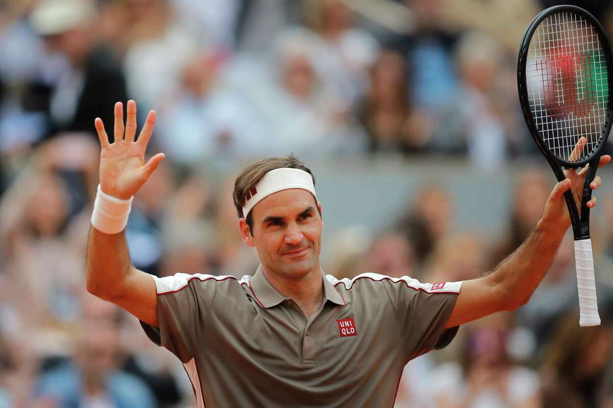 Switzerland's Roger Federer celebrates winning against Italy's Lorenzo Sonego during their first round match of the French Open tennis tournament at the Roland Garros stadium in Paris, Sunday, May 26, 2019. (AP Photo/Michel Euler )