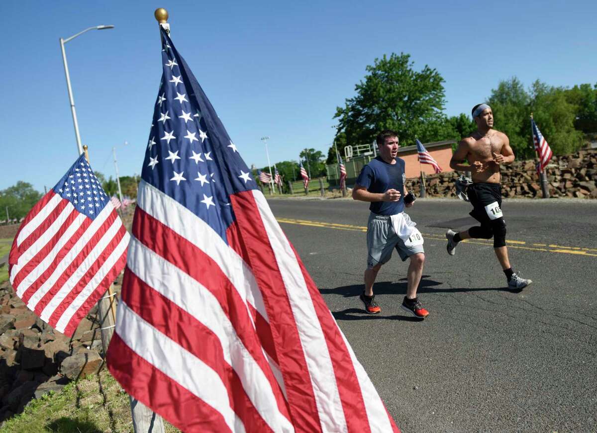 Photos from the first Memorial Day 5K run at Cummings Point Park in Stamford, Conn. Monday, May 27, 2019. Due to diminishing crowds and ongoing renovation of Veterans Memorial Park, Stamford held a 5K run and Memorial Day ceremony instead of the usual parade through downtown. About 300 runners participated in the 5K, which preceeded a service on the beach in honor of the fallen veterans.