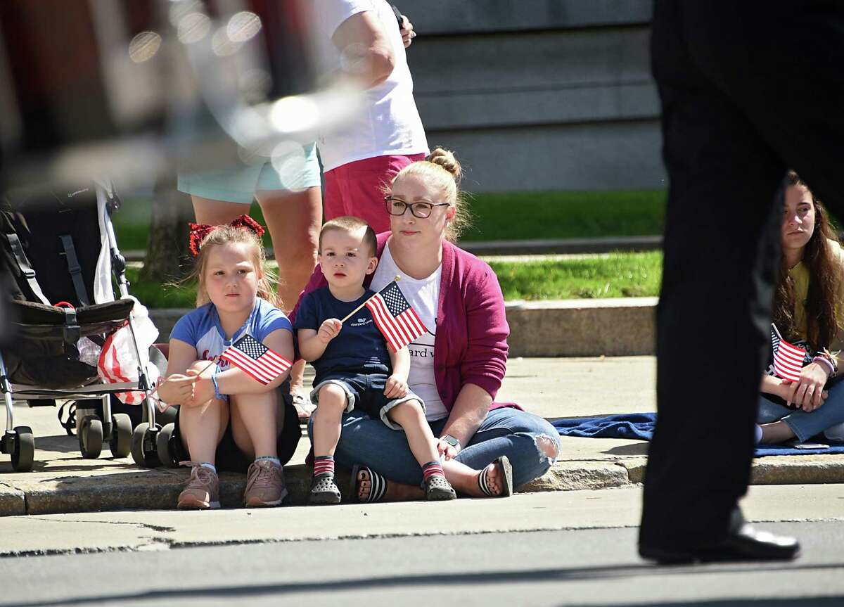 Julianne Venneman of Colonie and her children Avery, 6, and Holden, 2, watch the Albany Memorial Day Parade on Washington Ave. Monday, May 27, 2019 in Albany, N.Y. 