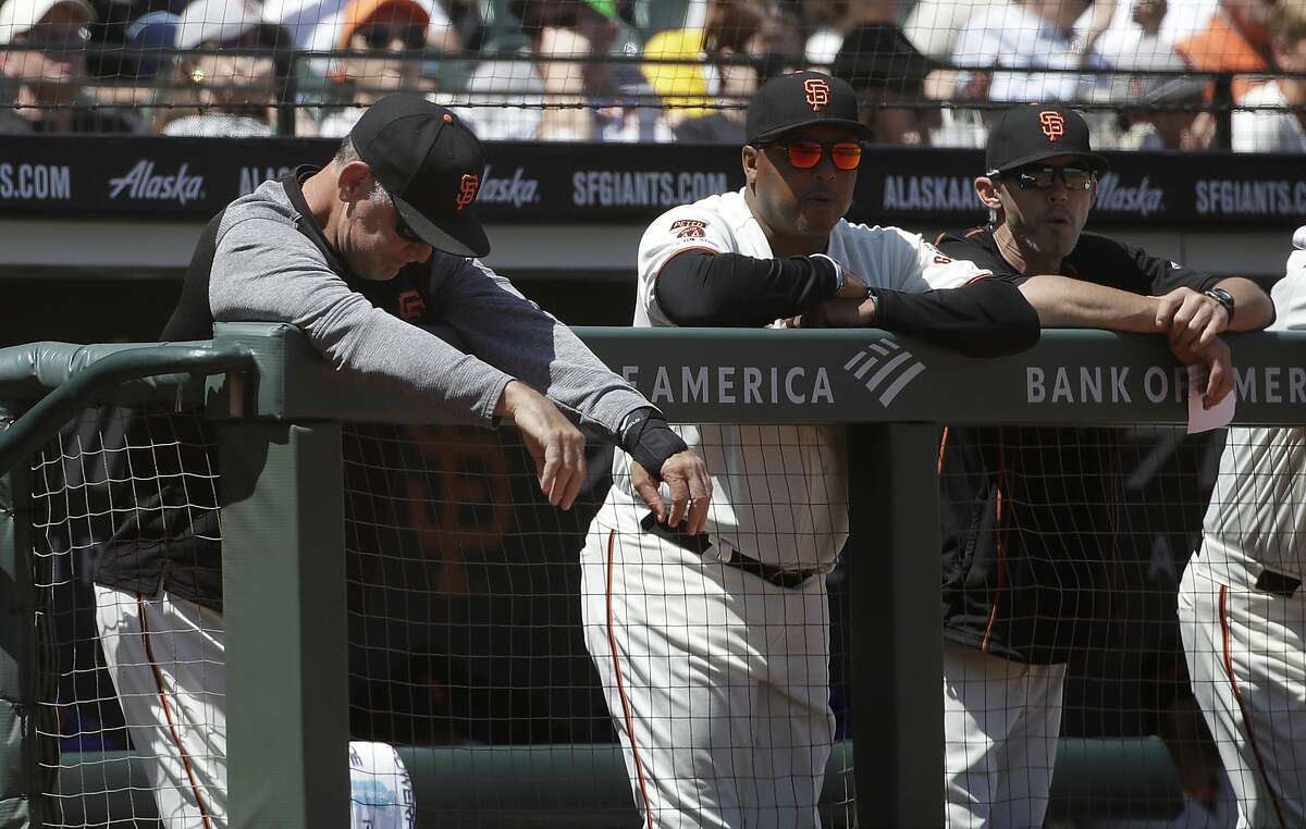 San Francisco Giants manager Bruce Bochy, left, stands in the dugout during the fifth inning of a baseball game against the Arizona Diamondbacks in San Francisco, Saturday, May 25, 2019. (AP Photo/Jeff Chiu)