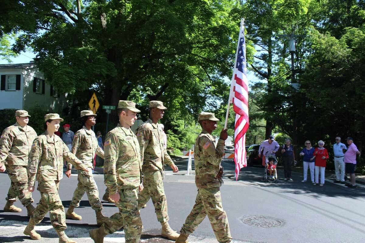 The American flag is carried toward the front of New Canaan's Memorial Day Parade Monday, May 27, 2019.