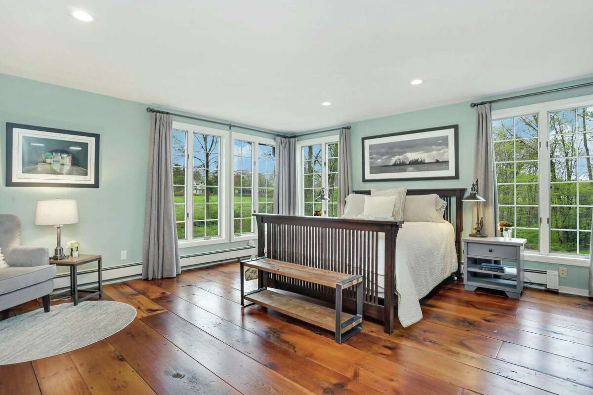 The master bedroom features two walk-in closets and a newly renovated master bath.