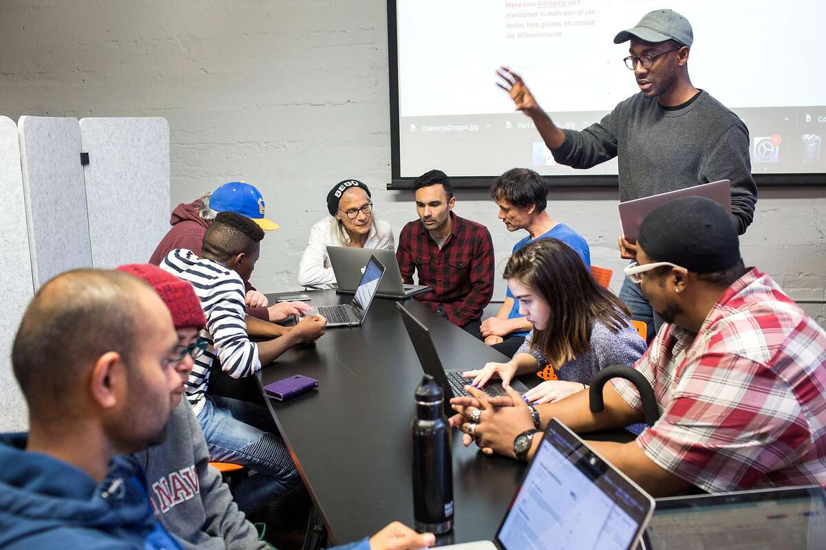 Attendees engage with volunteers during Datathon, an event initiated by nonprofit Shelter Tech during which volunteers work alongside homeless and formerly homeless people to verify and expand its database of services available for homeless people. At Intersection for the Arts on Tuesday, May 21, 2019. San Francisco, Calif.
