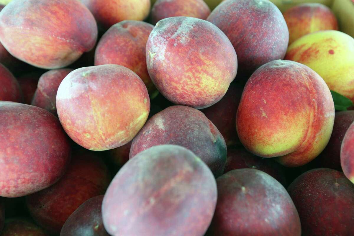 Peaches from Donald Eckhardt Orchards are seen Wednesday, May 22, 2019 at the family's stand on US 87 south of Fredericksburg. Virtually all Hill Country peach producers are reporting abundant crops of quality peaches.