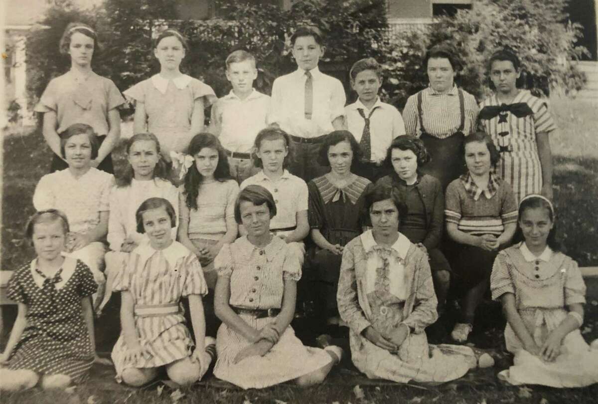 St. Francis School in New Milford celebrated its first graduating class in 1935. Among the graduates were, from left to right, in front, Geraldine Hulton, Veronica McMahon, Minnie Halpine, Helen Syniec and Lorraine Reynolds; second row, Theresa Raino, Josephine Kozieleic, Beatrice Martin, Phyllis Lawlor, Mary Ward, Shirley Harris and Jeanne Cuddy; and in back, Joan Carson, Mary Dolan, Paul E. Martin, William Moore, Joseph Kracheski, Marjorie Frizzel and Josephine Boucher. If you have a "Way Back When" photo you'd like to share, contact Deborah Rose at drose@newstimes.com or 860-355-7324.