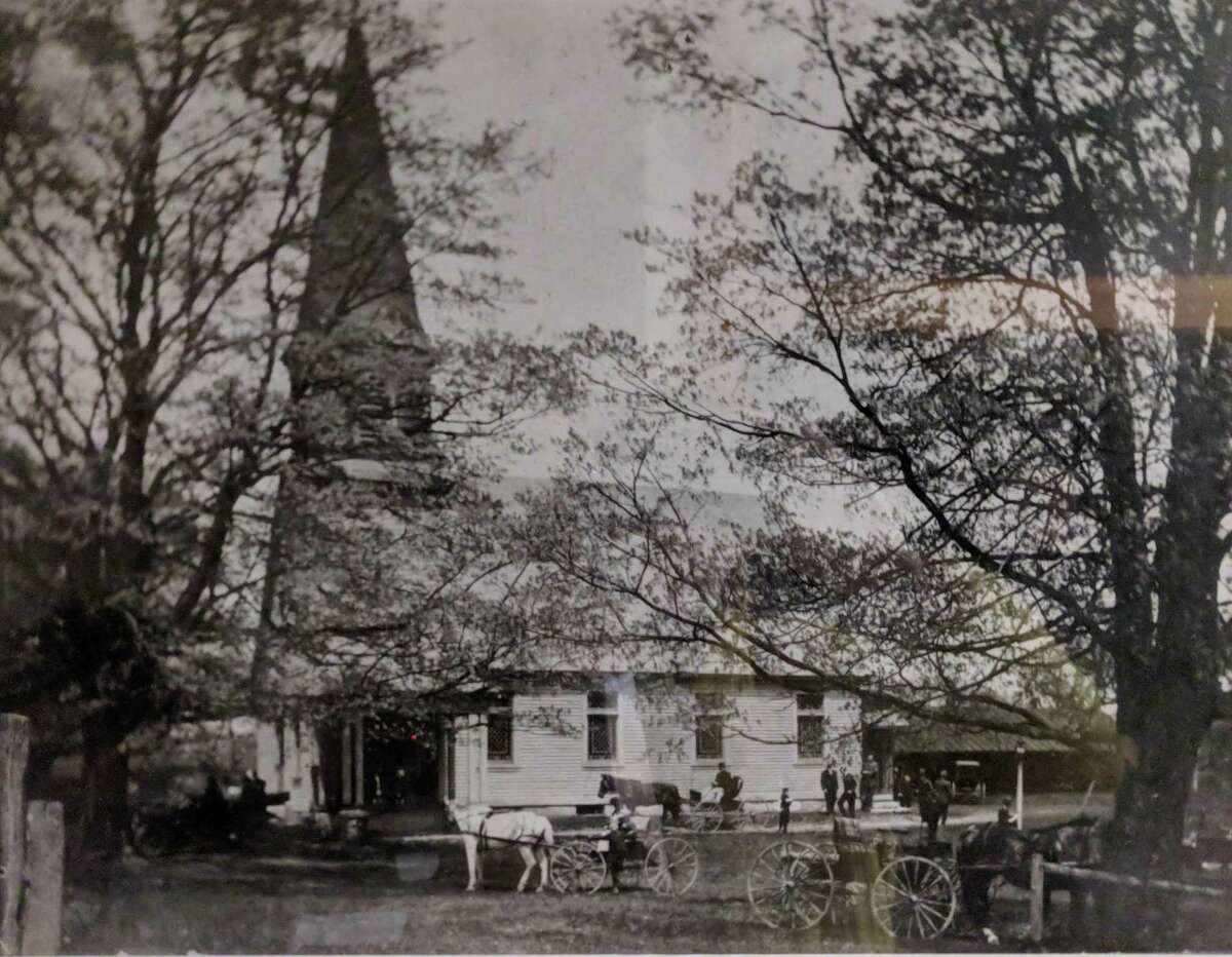 The Sherman Congregational Church is shown above 1914, with carriages bringing the faithful to church.