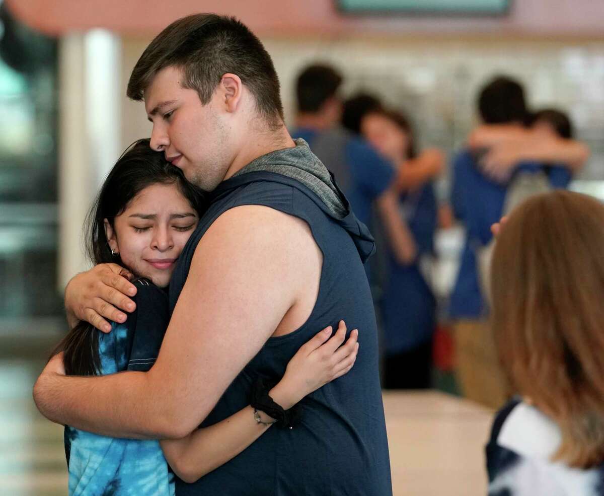 Students hug after gathering Tuesday, May 28, 2019 in Spring to remember Joseph Thomas, 16, a Spring High School sophomore, who drowned on Sunday. Thomas reportedly died while saving a friend after they became trapped in a strong rip current along Matagorda Beach.