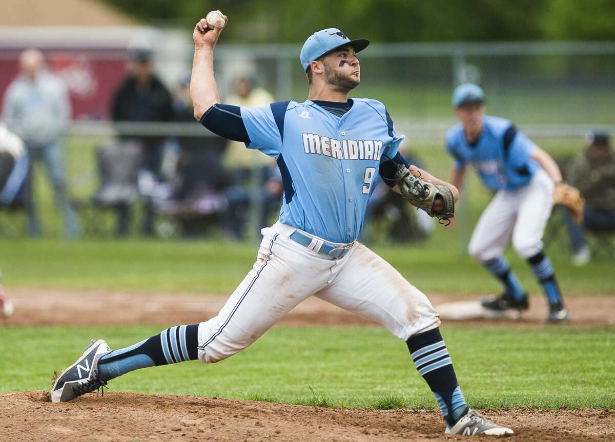 Meridian's Hunter Merillat pitches the ball during a game against Beaverton on Tuesday, May 28, 2019 at Beaverton High School. (Katy Kildee/kkildee@mdn.net)