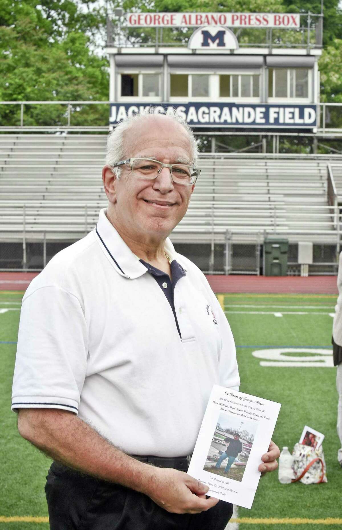 Longtime former Hour sports writer and columnist George Albano is honored with the naming of the press box at Brien McMahon High School’s Jack Casagrande Field on Tuesday in Norwalk.