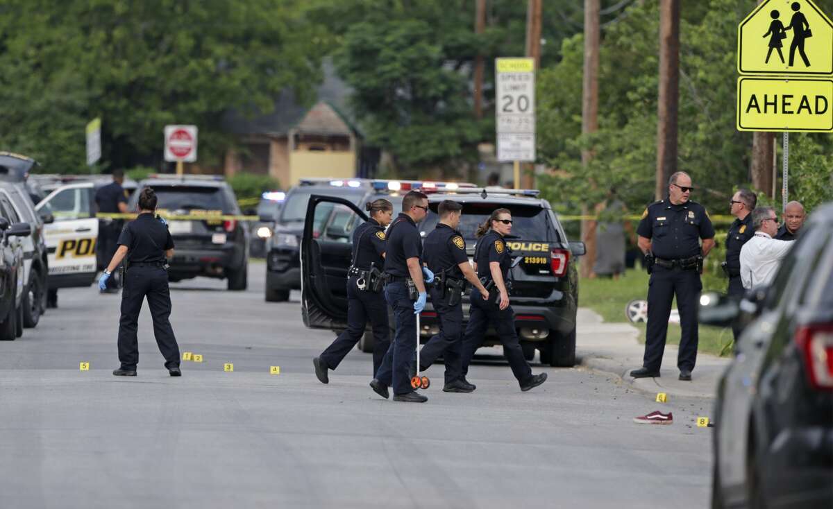 Police investigate the scene of a shooting at Hays and Lockhart streets on May 28, 2019.