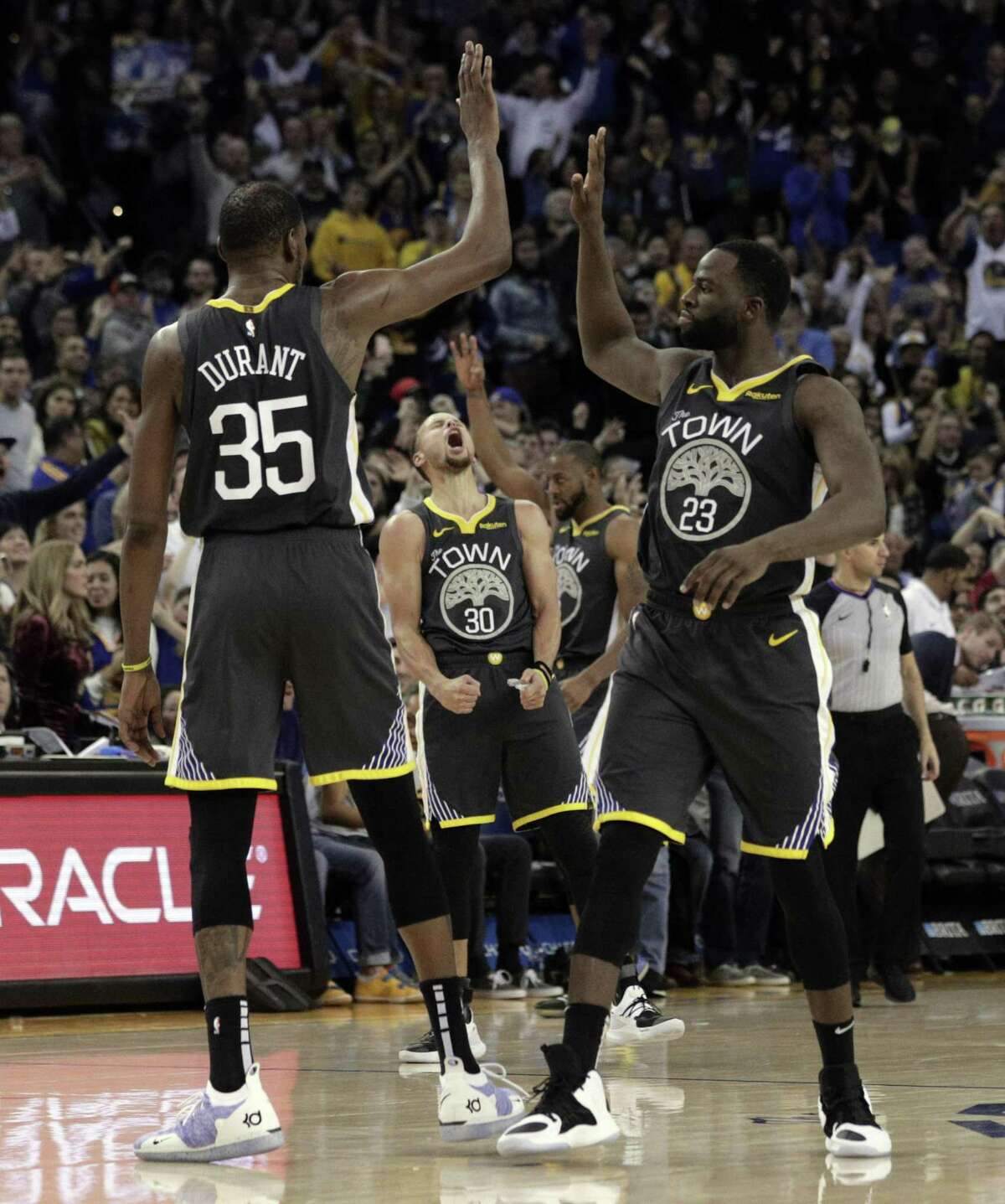 Protagonist Stephen Curry and Draymond Green celebrate a trey by Kevin Durant, who’s central to the dynasty plotline.