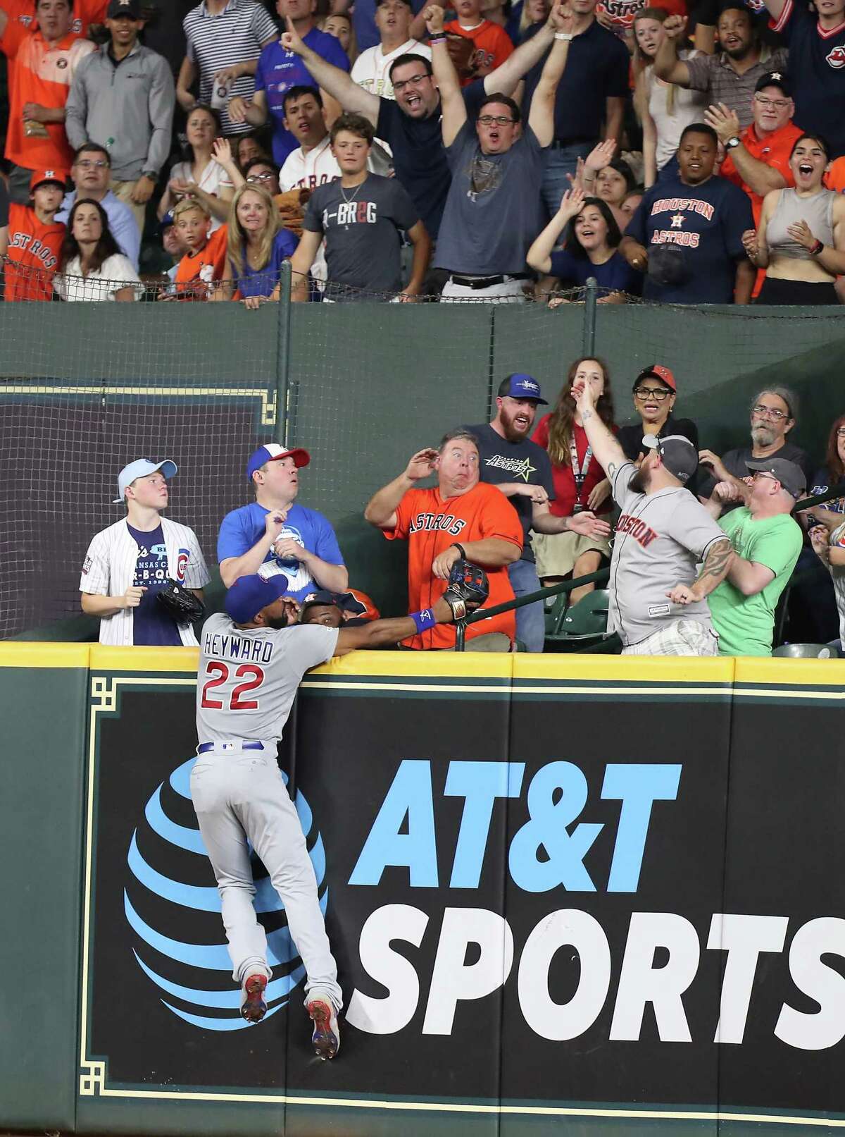 Chicago Cubs right fielder Jason Heyward (22) could reach Houston Astros third baseman Alex Bregman (2) homer during the 6th-inning of an MLB baseball game at Minute Maid Park Tuesday, May 28, 2019, in Houston.