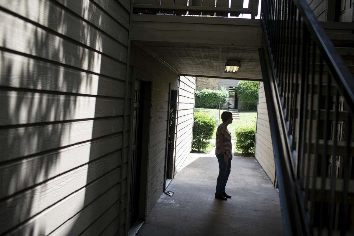 Anne Marie Miller stands outside of an apartment where she says she was abused by Mark Aderholt. She was 16 and he was 25.