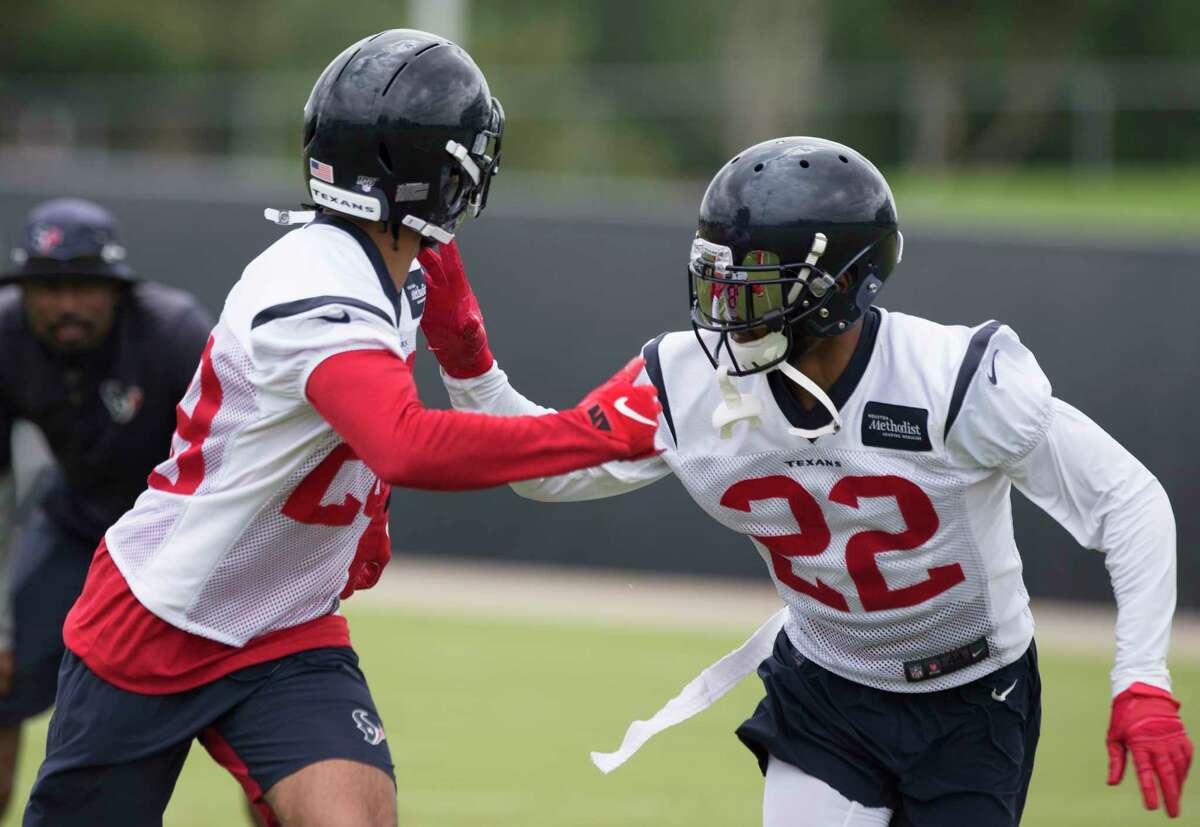 Cornerbacks Xavier Crawford (28) and Aaron Colvin (22) work on a drill during Houston Texans OTA's at the Houston Methodist Training Center on Wednesday, May 29, 2019, in Houston.