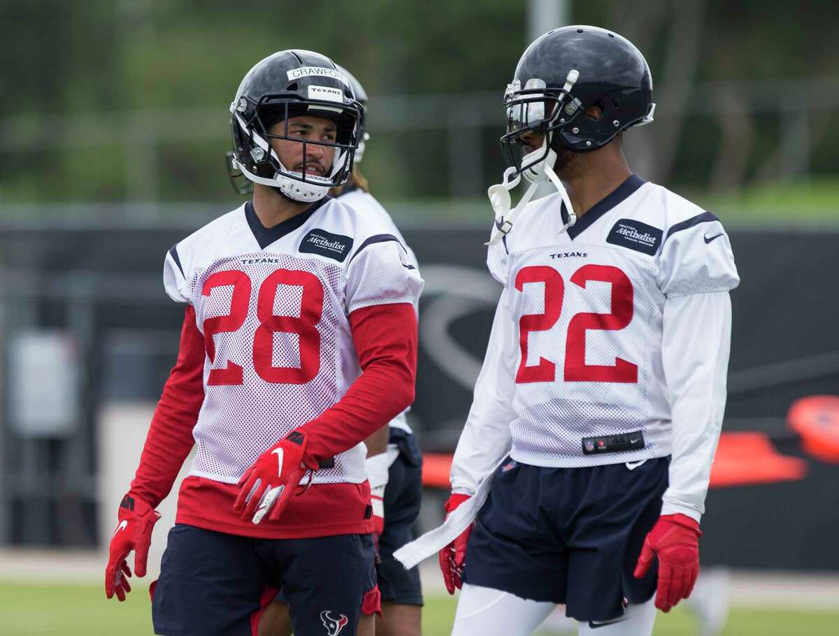 Cornerbacks Xavier Crawford (28) and Aaron Colvin (22) talk to each other during Houston Texans OTA's at the Houston Methodist Training Center on Wednesday, May 29, 2019, in Houston.