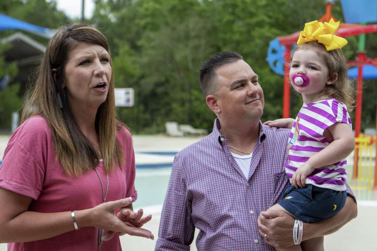 From left, Loretta Machann and Allan Machann tell the story of Lilly Machann, 2, drowning accident during a water safety and drowning prevention media day Wednesday, May 29, 2019 at Bear Branch Pool in The Woodlands.