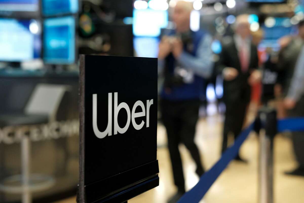 NEW YORK, NEW YORK - MAY 10: An Uber sign is displayed as traders work on the floor of the New York Stock Exchange (NYSE) before the Opening Bell at the NYSE as the ride-hailing company Uber makes its highly anticipated initial public offering (IPO) on May 10, 2019 in New York City. Uber will start trading on the New York Stock Exchange after raising $8.1 billion in the biggest U.S. IPO in five years.Thousands of Uber and other app based drivers protested around the country on Wednesday to demand better pay and working conditions including sick leave, overtime and a minimum wage. (Photo by Spencer Platt/Getty Images)