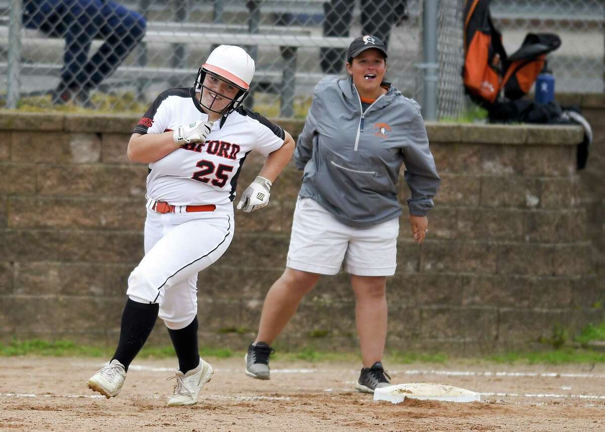 Stamford's Abby Hogan celebrates a fifth-inning grand slam against New Milford in the Class LL state tournament on Wednesday. Host Stamford won, 10-0.