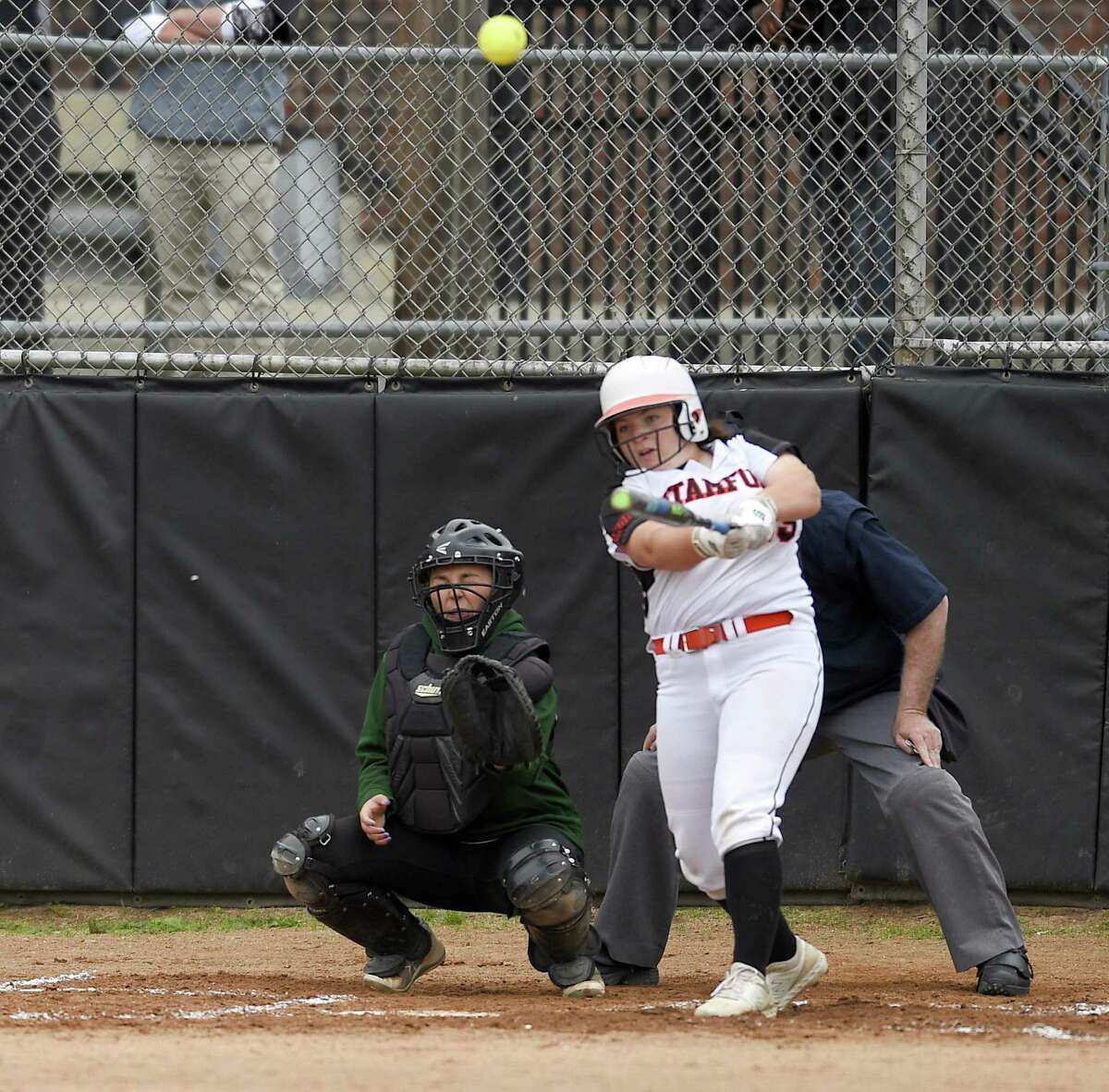 Stamford's Abby Hogan belts a fifth-inning grand slam against New Milford in the Class LL state tournament on Wednesday. Host Stamford won, 10-0.