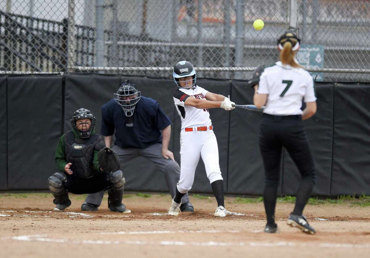 Stamford's Kim Saunders hits a two-run homer in the fourth inning against New Milford in the Class LL state tournament in Stamford on Wednesday. Stamford won, 10-0.