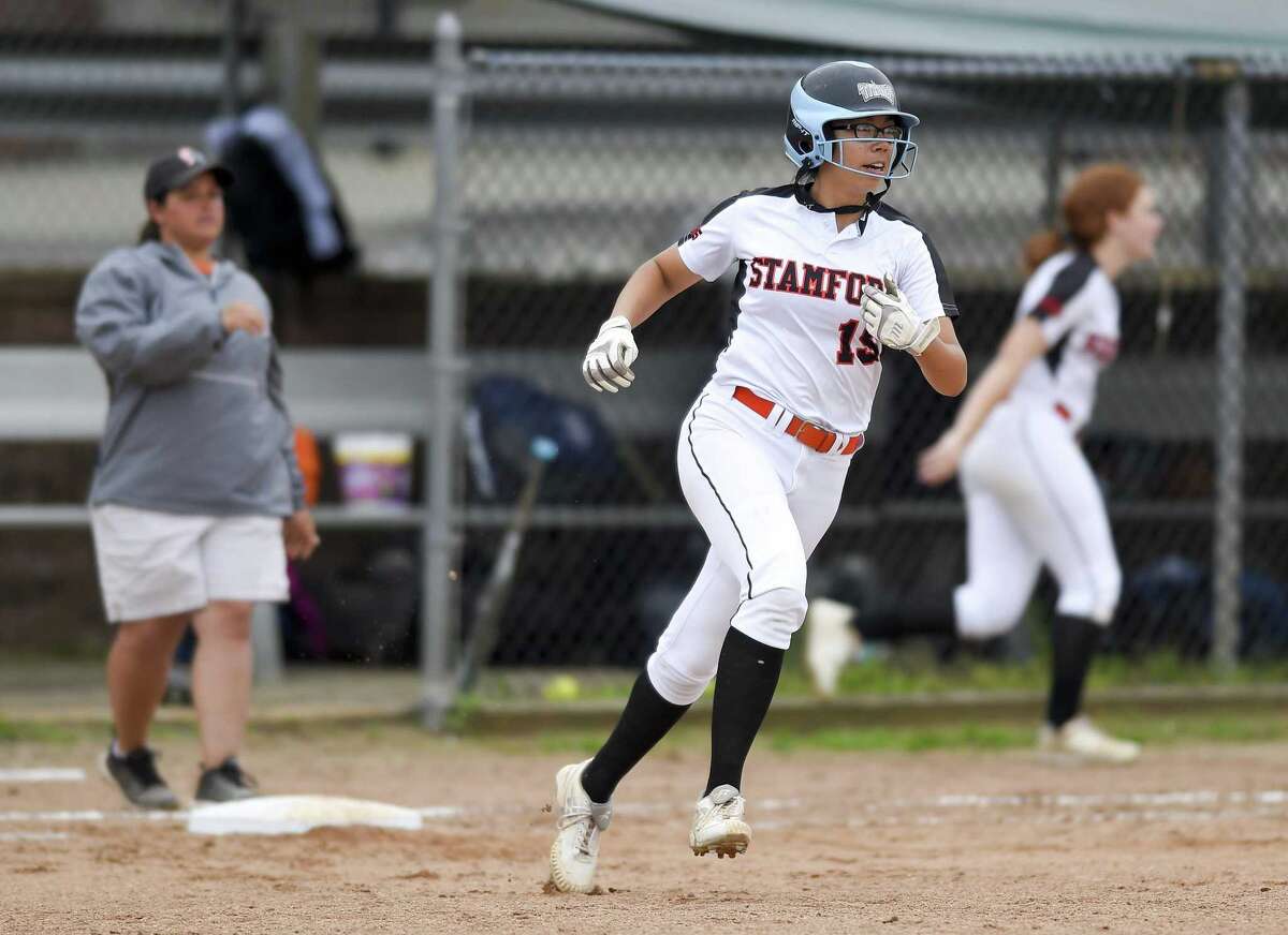 Stamford's Kim Saunders rounds the bases following a two-run homer in the fourth inning against New Milford in the Class LL state tournament at Stamford on Wednesday. Stamford won, 10-0.