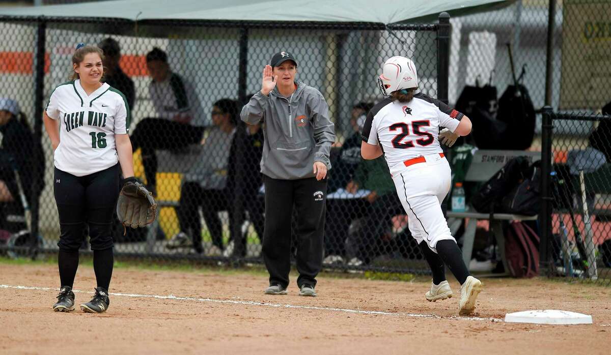 Stamford coach Melissa Giordano celebrates with Abby Hogan following her fifth inning grand slam against New Milford in the CIAC Class LL softball tournament at Stamford High School on May 29, 2019 in Stamford, Connecticut.