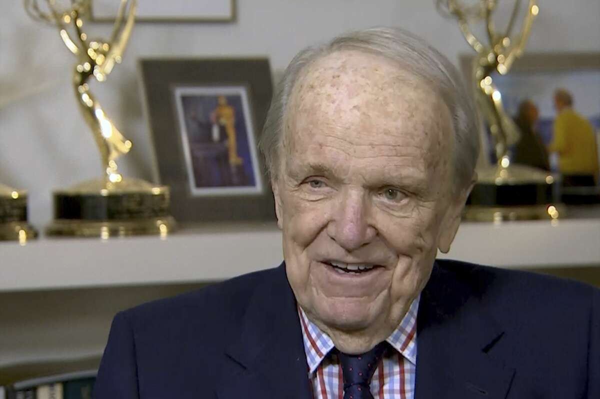 In this image from video, George Stevens Jr. speaks during an interview with The Associated Press in Washington. George Stevens Jr., now 87, was a child when his Dad left to cover the war. Only after his fatherâs death, decades later, did he discover reels of the color film in storage. âI was sitting alone, and on the screen came images of a gray day and rough seas and a large ship and barrage balloons up in the sky. And I realized it was D-Day. (AP Photo)
