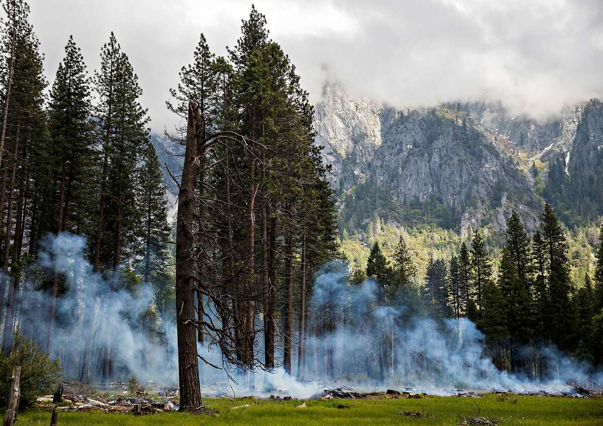 Smoke rises from a controlled burn operation in Yosemite Valley at Yosemite National Park in Yosemite, Calif. Tuesday, May 28, 2019.
