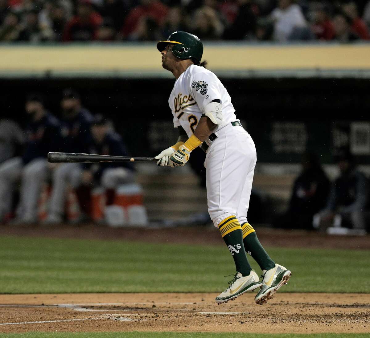 Khris Davis (2) hops up as he watches his solo homerun in the second inning as the Oakland Athletics played the Boston Red Sox at the Coliseum in Oakland, Calif., on Monday, April 1, 2019.