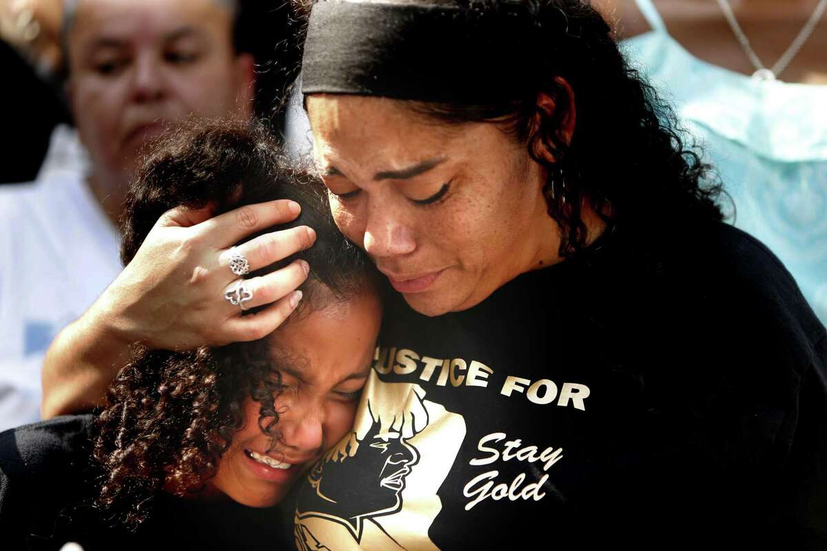 Bernice Roundtree comforts her daughter J'Kyah,8, after the news conference. Lawyer Daryl K. Washington and the family of Charles Roundtree Jr. are holding a news conference and rally today in front of the Bexar County District Attorney’s officeWednesday, May 29, 2019