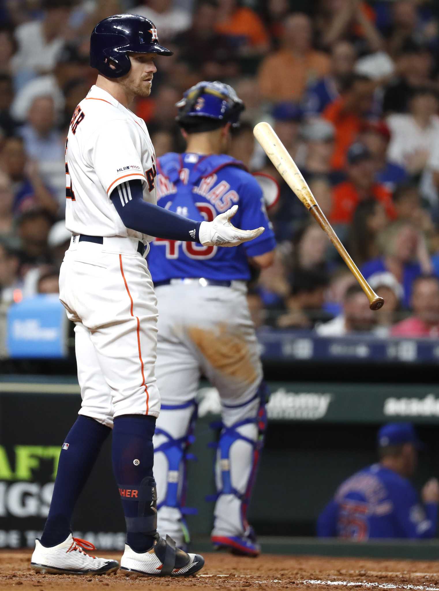 Chicago Cubs' Albert Almora Jr., right, reacts after hitting a foul ball  into the stands as, from left to right, Jason Heyward, manager Joe Maddon  and Javier Baez talk with him during