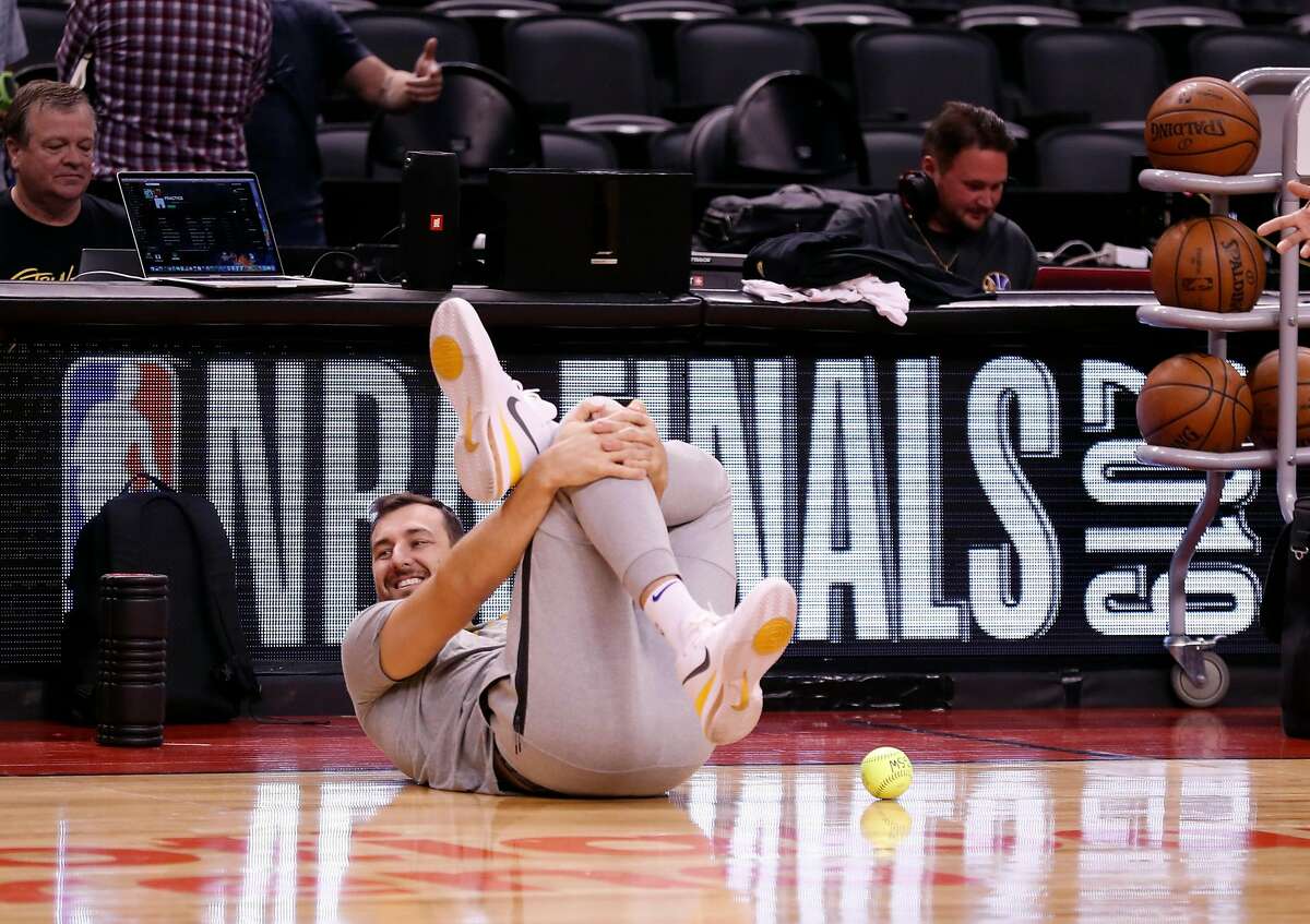 Golden State Warriors' Andrew Bogut stretches before practicing at ScotiaBank Arena in Toronto, Ontario, Canada, on Wednesday, May 29, 2019.