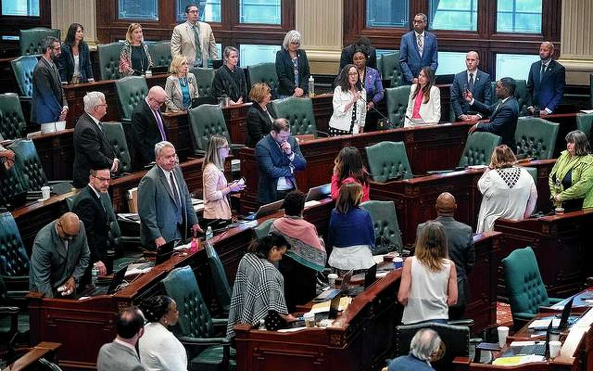 Illinois House of Representative members meet in Springfield. A group of Republican legislators is calling for an end to a procedure that enables substantive legislation in the House to pass without an individual roll-call vote.